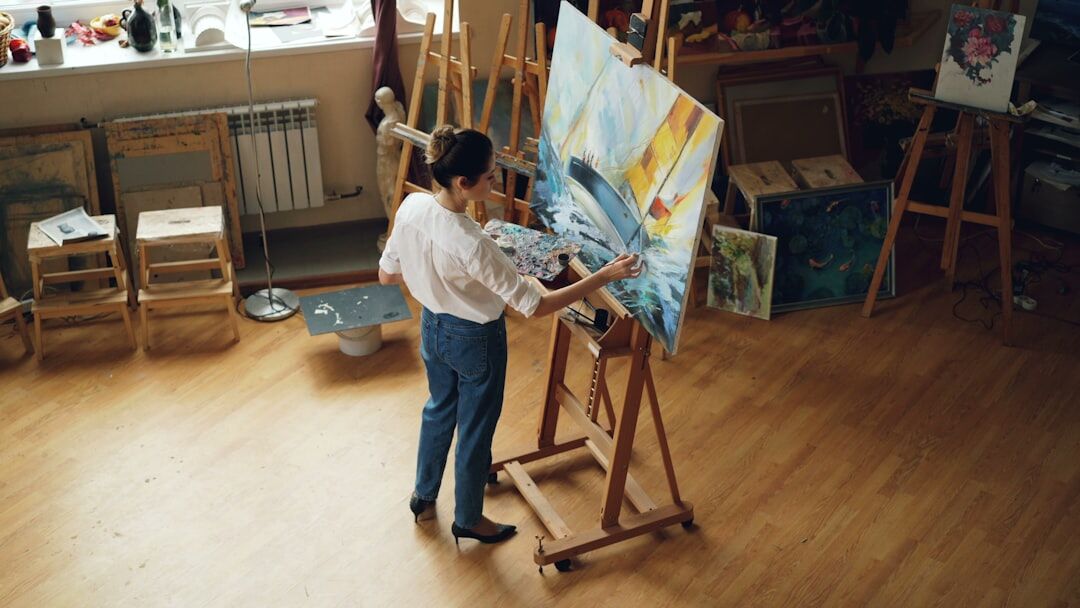 Slovak seniors painting together at an art workshop table